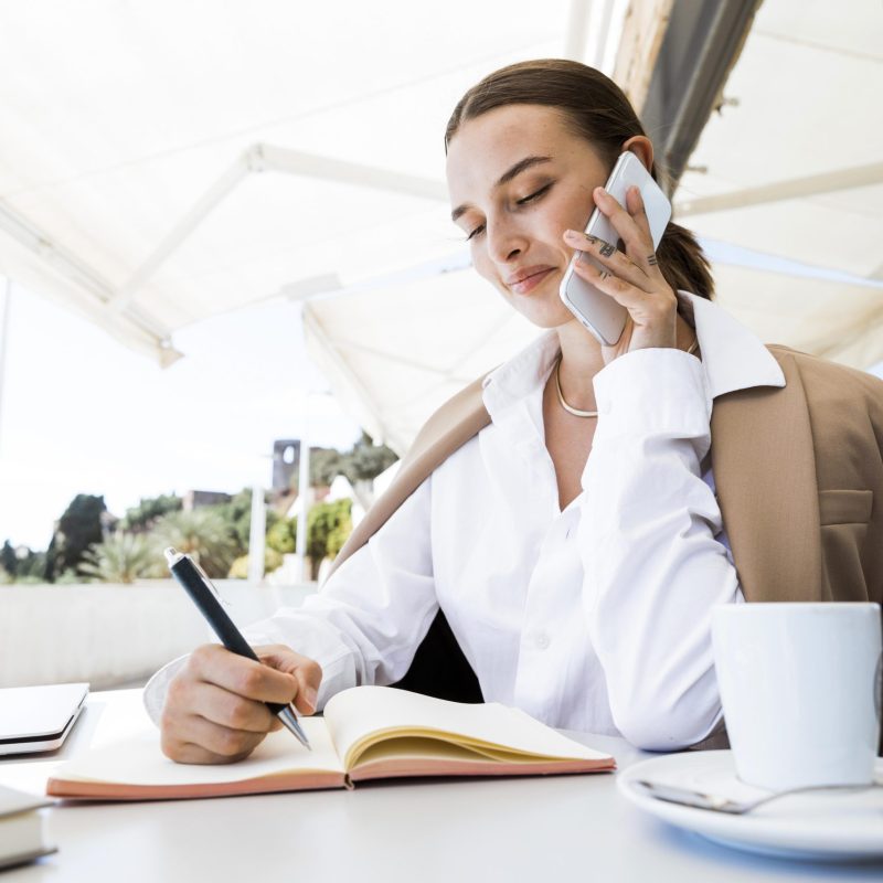 medium shot woman taking notes